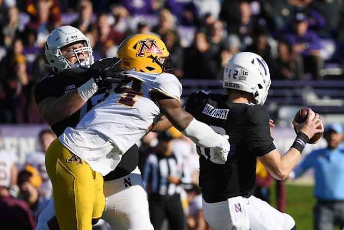 Oct 30, 2021; Evanston, Illinois, USA; Minnesota Golden Gophers defensive lineman Boye Mafe (34) sacks Northwestern Wildcats quarterback Ryan Hilinski (12) in the first half at Ryan Field. Mandatory Credit: Quinn Harris-USA TODAY Sports